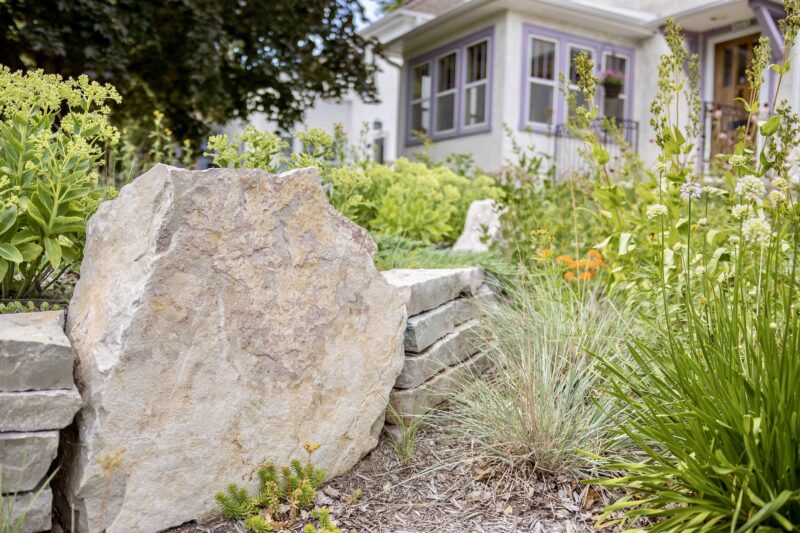 large stone and stone wall in garden